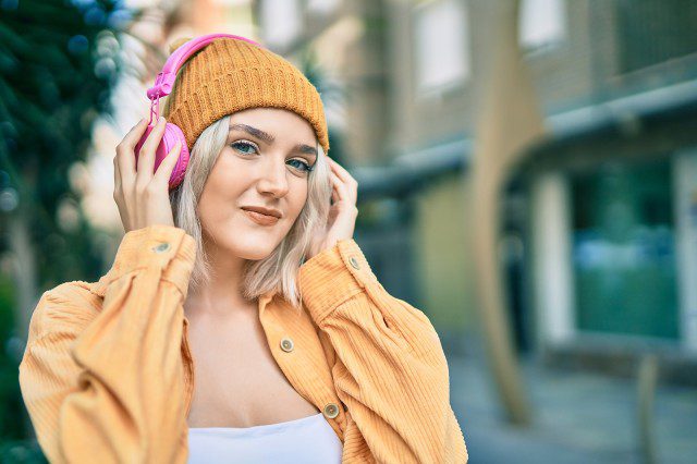 b2ap3_medium_bigstock-Young-blonde-girl-using-headph-422570624-1