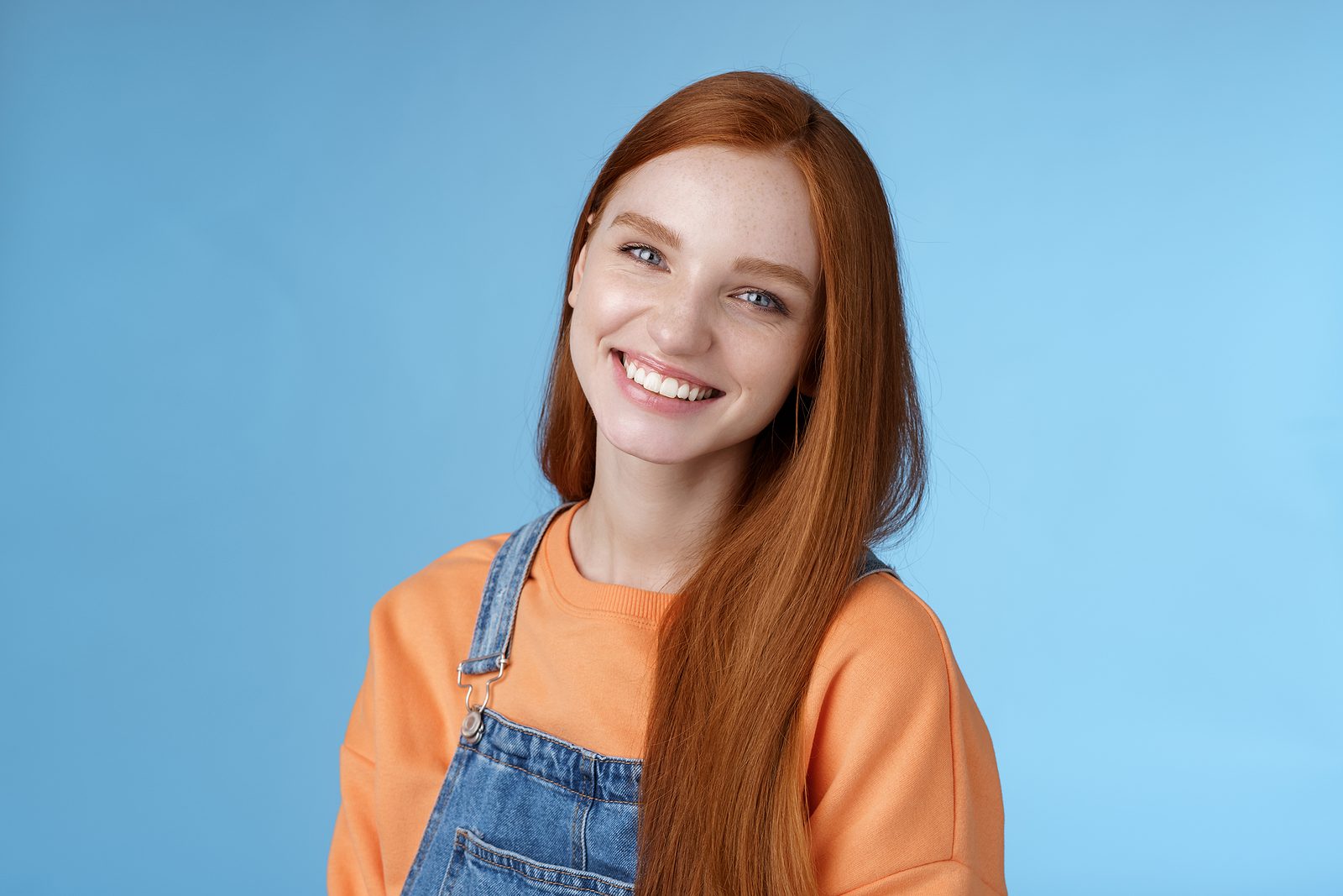 Pleasant Sincere Happy Ginger Girl Blue Eyes Tilting Head Grinni