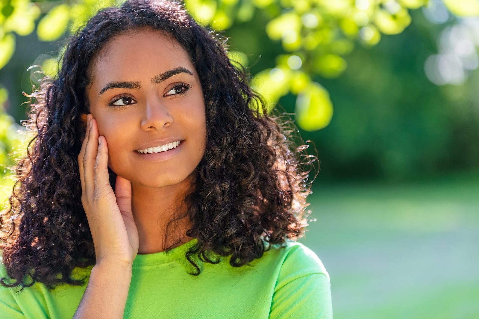 Outdoor portrait of beautiful happy mixed race African American