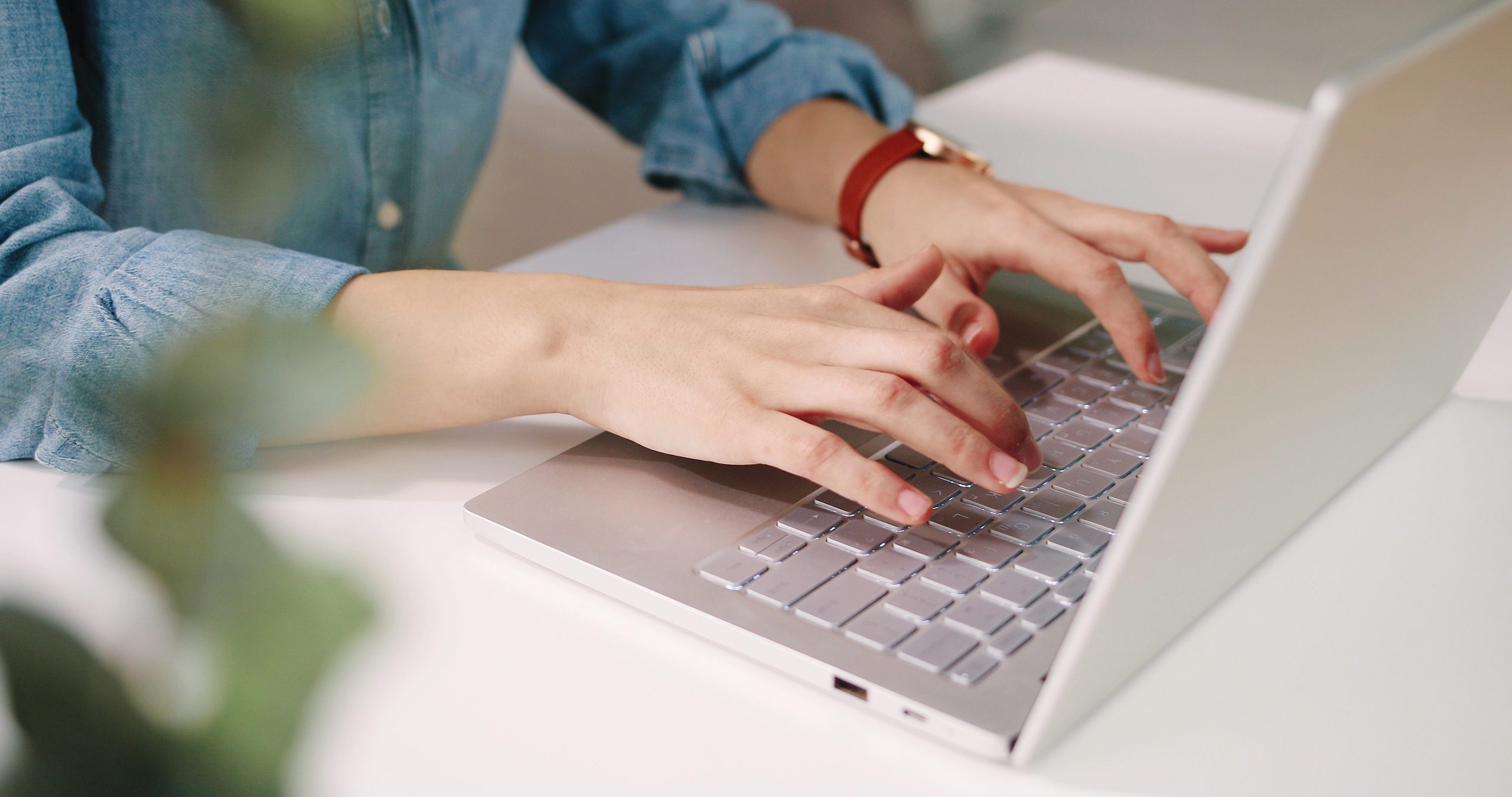 Close Up Shot Of Caucasian Female Hands Working On White Modern