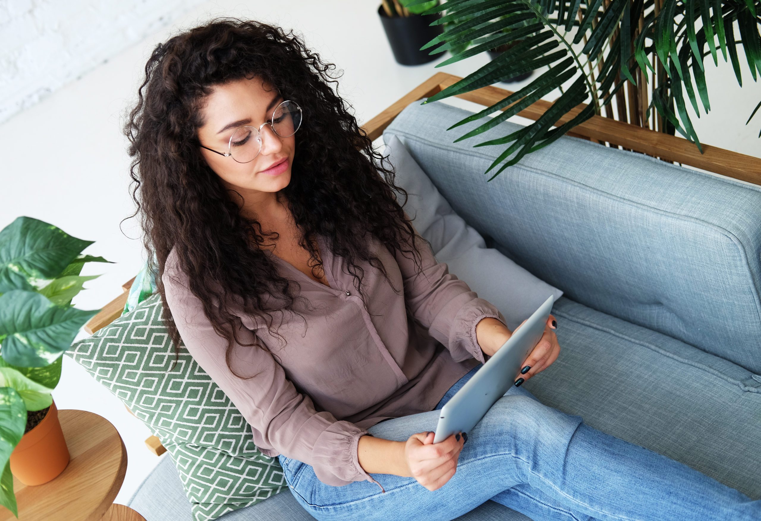 Portrait of an attractive young african woman using a digital ta
