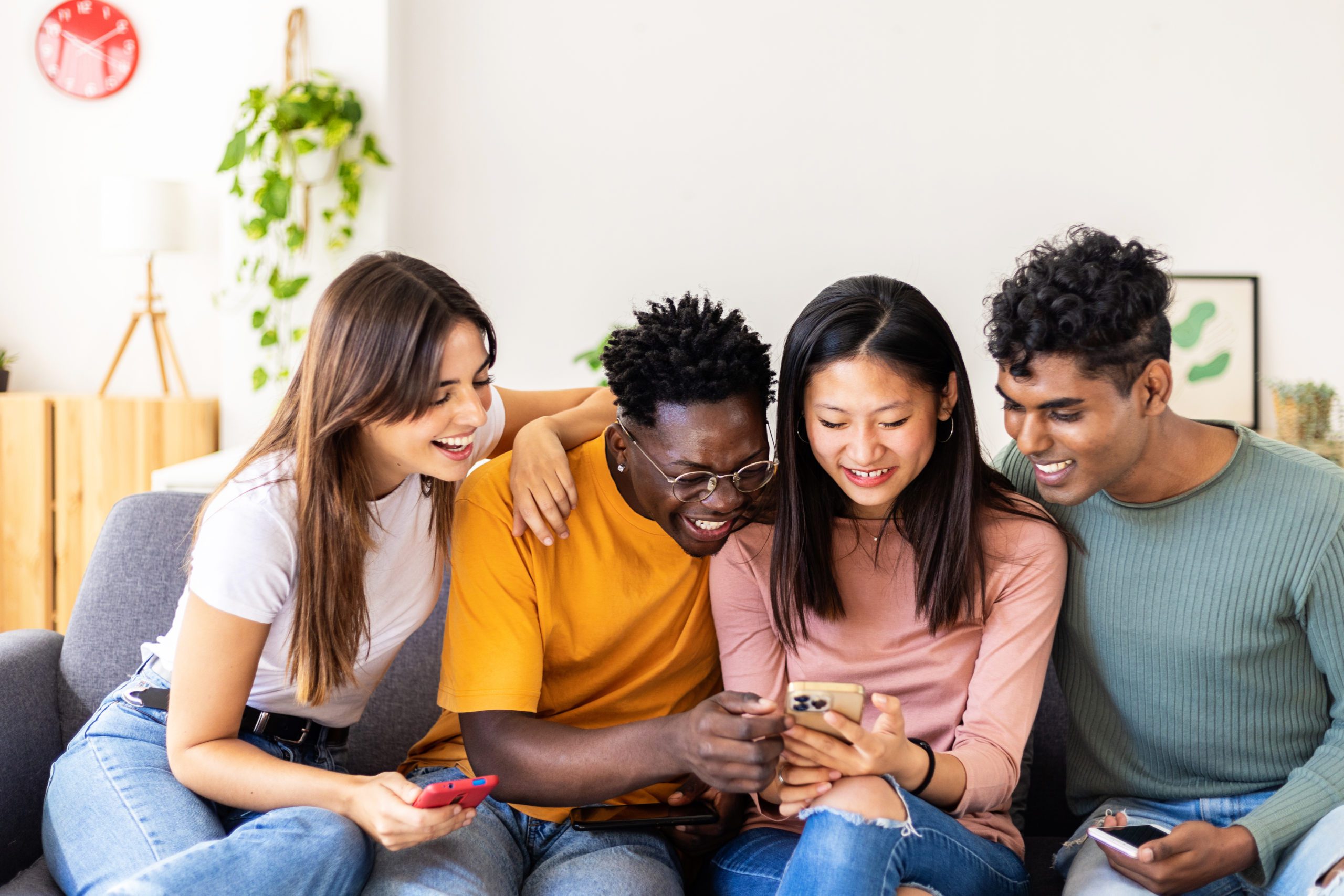 Young Millennial Group Of Multiracial Friends Having Fun Using M